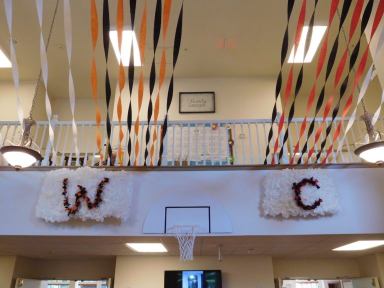 Columbia Ridge Senior Living staff members decorated the front lobby with the Washougal and Camas high schools' colors for the annual Senior Prom, Thursday, July 26, at Columbia Ridge, in Washougal.
