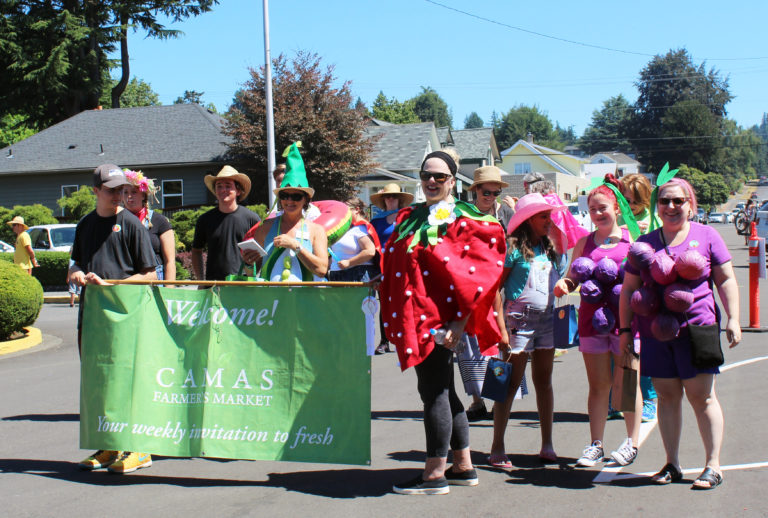 Camas Farmer's Market organizers and fans march in the 2018 Camas Days Kids Parade on Friday, July 27.