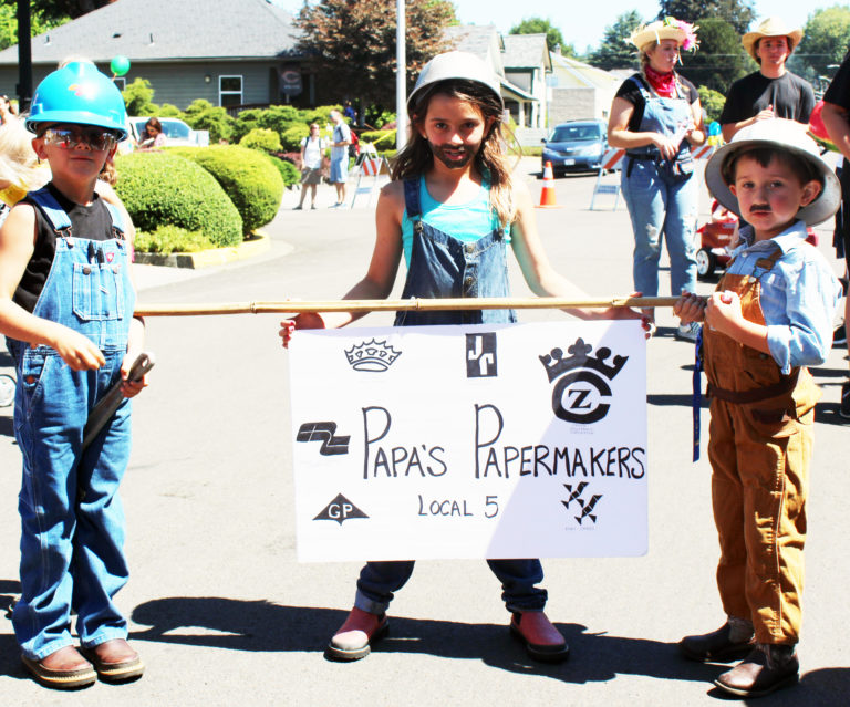 "Papa's Papermakers," from left to right: Lane Lambert 6; Sunni Lambert, 9; and Lincoln Ochs, 4 participate in the 2018 Camas Days Kids Parade on Friday, July 27.