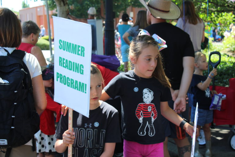 Children gather next to the Camas Public Library before the 2018 Camas Days Kids Parade on Friday, July 27.