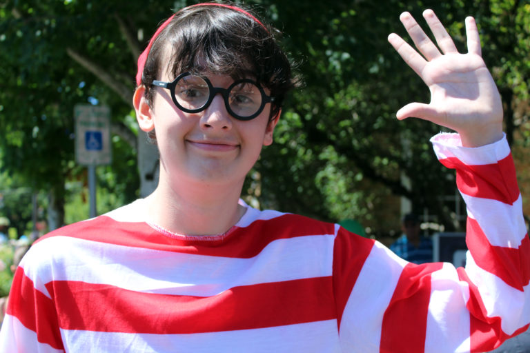 "Waldo," 14-year-old Sam Underwood, waves hello during the 2018 Camas Days Kids Parade on Friday, July 27, in downtown Camas.
