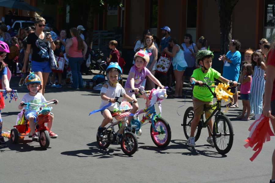 Camas Days Kids Parade youngsters ride decorated bike floats down Northeast Fourth Avenue, Friday, July 27. (Contributed photo courtesy of Krista Bashaw)
