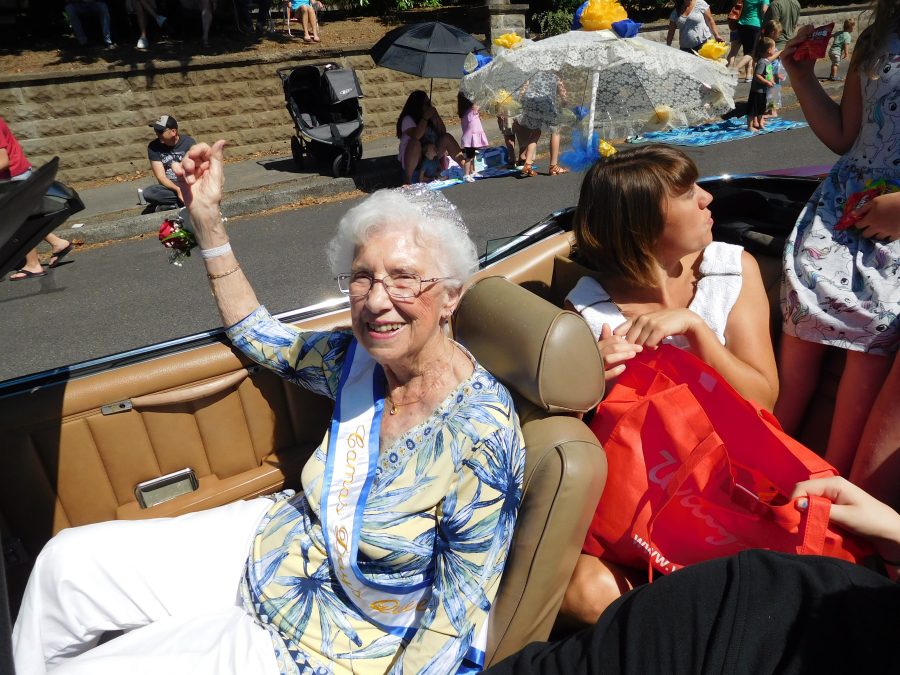 Maxine Ambrose, queen of the 2018 Camas Days festival, rides with family members in the Camas Days Grand Parade, Saturday, July 28. Ambrose, a 1948 Camas High School graduate, has volunteered with the Inter-Faith Treasure House, Soroptimist International of Camas-Washougal, the Camas-Washougal Historical Society, the Two Rivers Heritage Museum, the Lost and Found Cafe, Friends of the Cemetery, Boy Scouts and her children's school PTAs. 