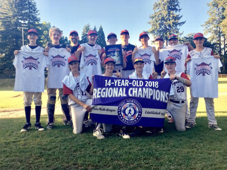 The Hit Squad from Woodland display their championship banner and T-shirts at Camas&#039; Louis Bloch Park on Saturday, July 28. The Clark County team now heads to Eagle Pass, Texas, to play in the Babe Ruth World series on Aug.