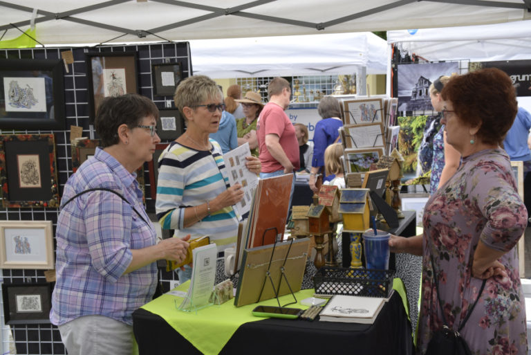 Shoppers hunt for treasures at the 2017 Washougal Art Festival in Washougal&#039;s Reflection Plaza. This year&#039;s festival features 26 professional, juried artists from across Southwest Washington, and will be held Saturday, Aug. 11, in downtown Washougal.