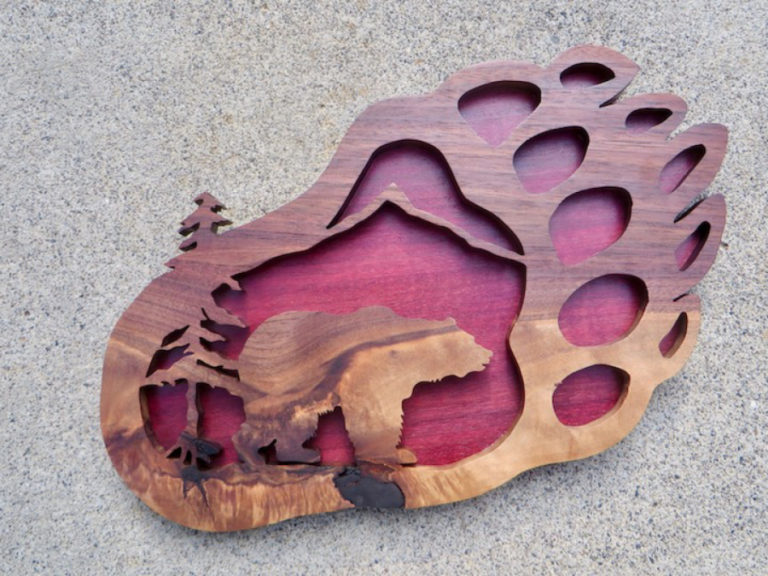 A carved wooden bear paw by Amboy artist Beck Lipp.