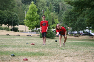 Kael Romero (left) and his mother, Sheri Romero (right) practice bocce near the Lacamas Lake Lodge. There are few public bocce ball courts in the area outside of local wineries, however the sport that was popular in ancient Rome is growing in popularity around the Pacific Northwest.