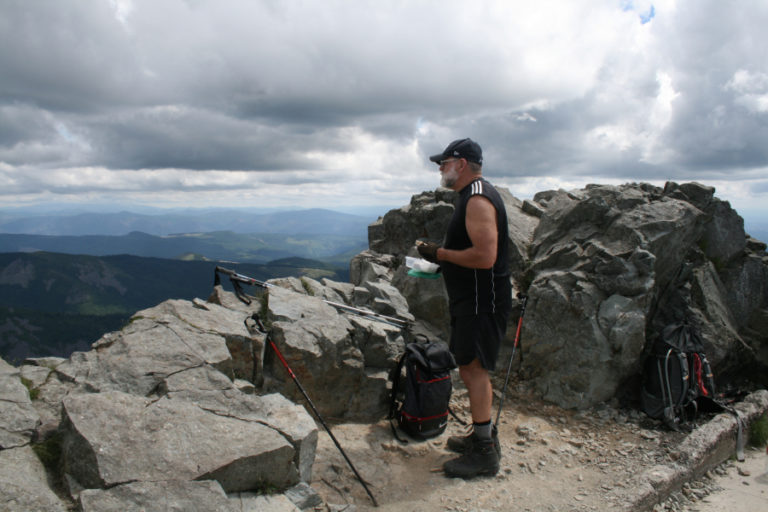 Jeff Booth enjoys lunch and tries to spot his home in Portland from the summit of Silver Star Mountain.