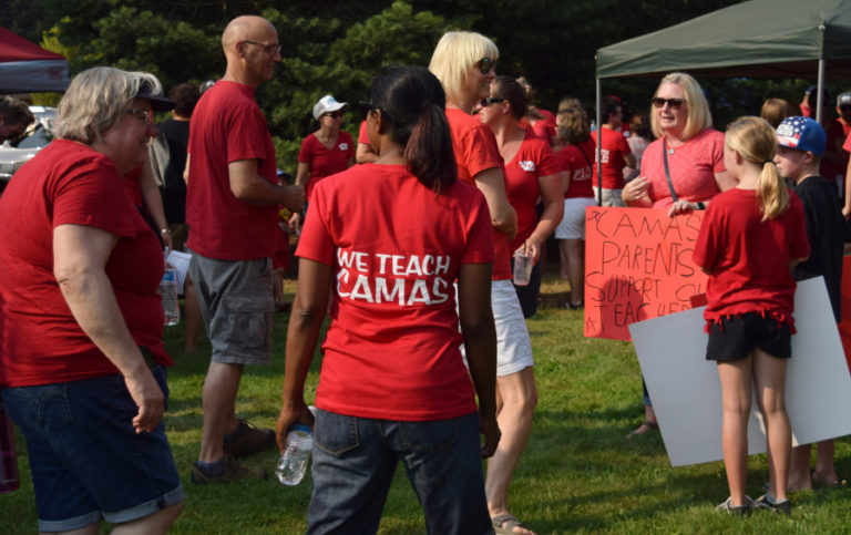 Camas Educators Association (CEA) members, parents and students mingle during the CEA tailgate on Aug.