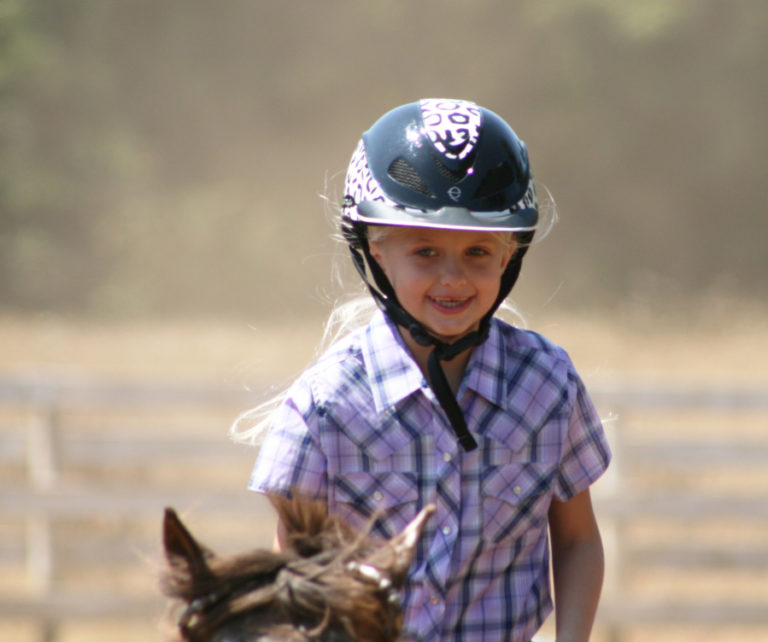 Aubrie Wheeler, 8, rides her pony, &quot;Little Romeo,&quot; at her home near Fern Prairie in Camas. Wheeler is the top all-around, under-9 pony rider in the nation after winning first place at the National Congress pony show in Tulsa, Oklahoma, in July.