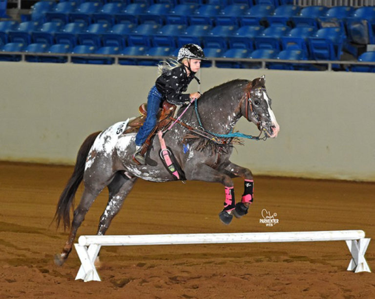 Aubrie Wheeler, 8, of Camas, displays her jumping skills at the National Congress horse show in Tulsa, Oklahoma, in July.