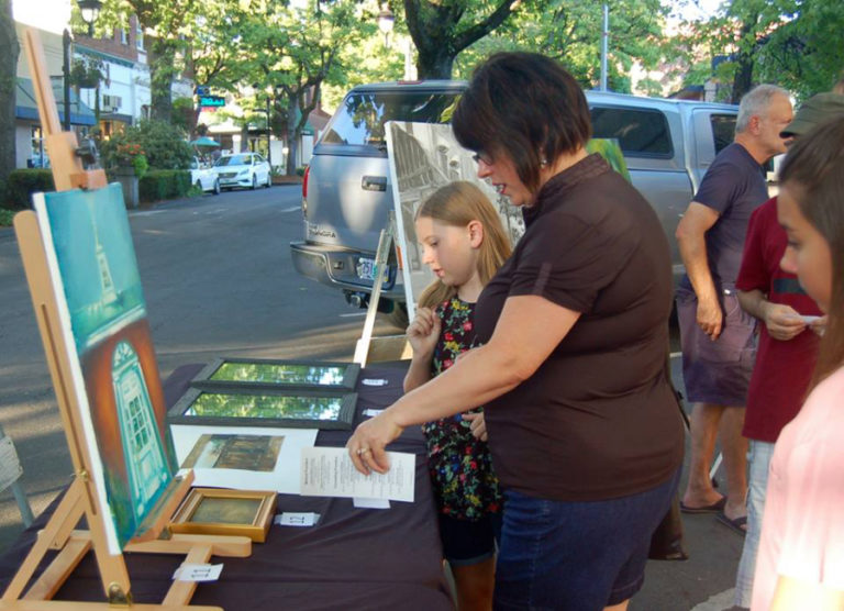 Gina Mariotti Shapard and her daughters vote for &quot;People&#039;s Choice&quot; awards during Camas&#039; 2017 Plein Air art event in September 2017. This year&#039;s Plein Air show will be held throughout the day, Friday, Sept.