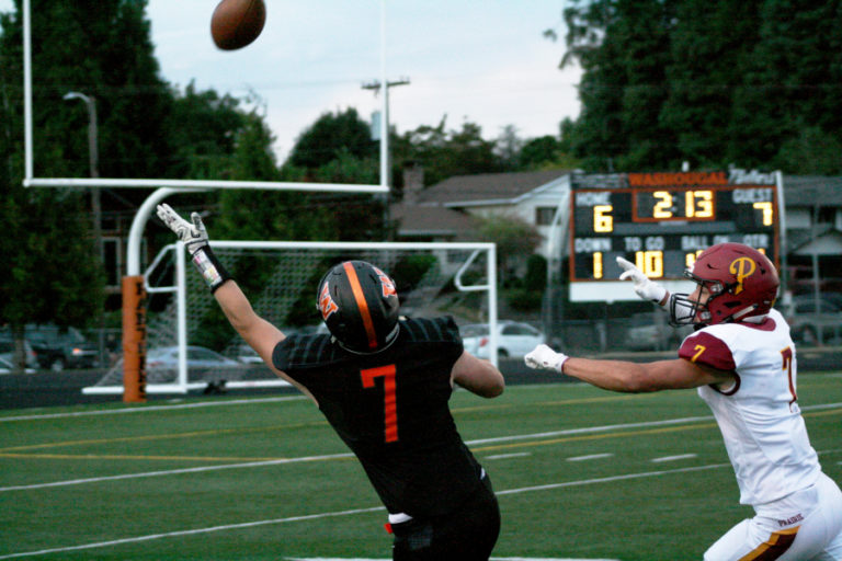 Washougal reciever Jakob Davis stretches out for a catch after beating the Prairie defense. Davis had a 67-yard touchdown catch, but also had a personal foul that helped create controversy near the end of the game.