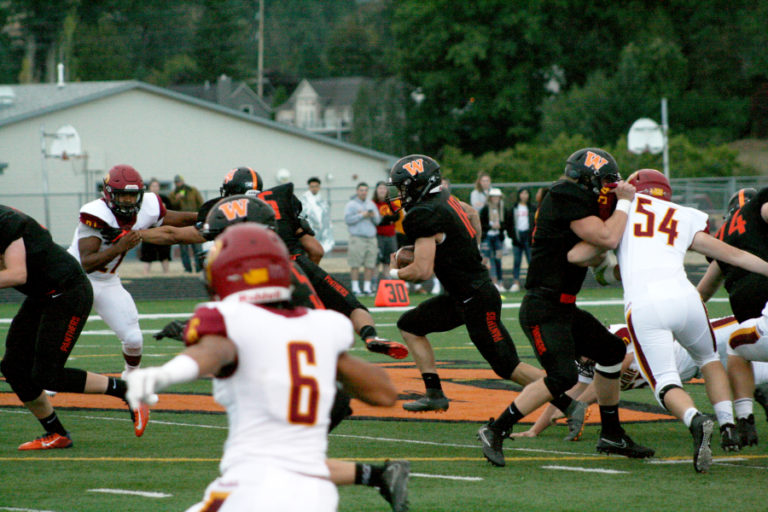 The Panthers Brevan Bea rushes through a hole on his way to one of two first half touchdowns against Prairie at Fishback Stadium in Washougal, Friday, Sept.
