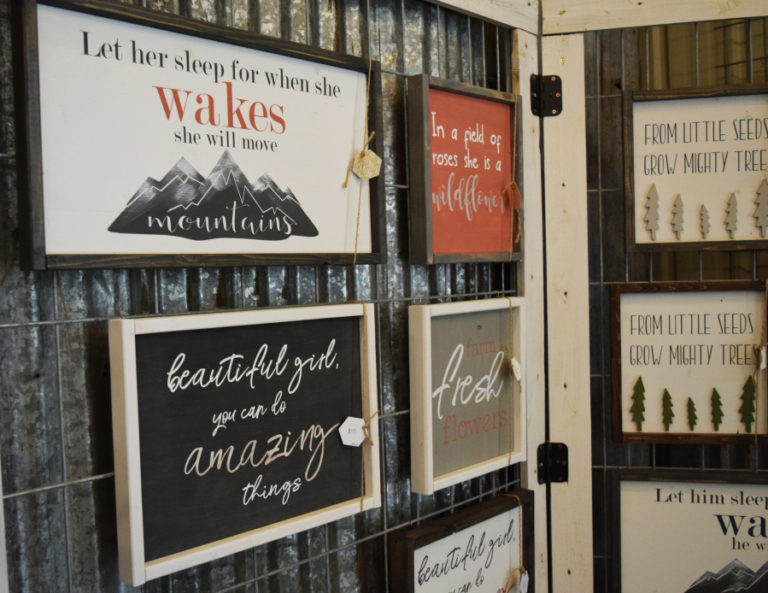 The signs that make-up the Honey BE Kids collection hang in the Washougal-based business, located inside owner Kendra Christensen&#039;s family farmhouse.
