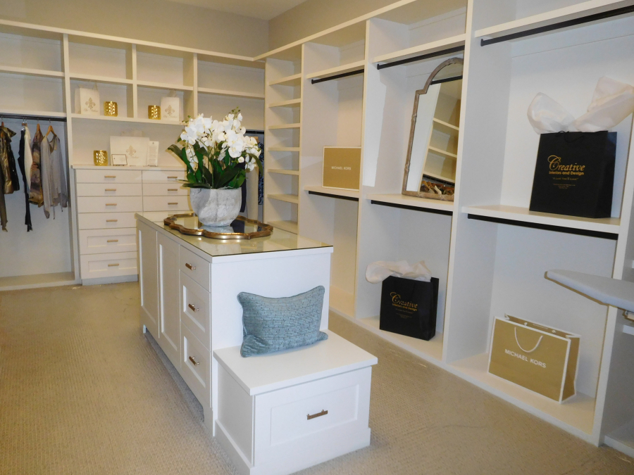 The master closet in "The Black Pearl," by Soaring Eagle Homes, of Camas, includes an island and built-in iron center, shelving and dressers.