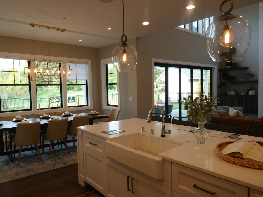 "The Arcadia," by Axiom Homes, designed to look like a traditional farmhouse, has a great kitchen for gathering. The 4,827-square-foot home also has a lounge and craft and theater rooms.