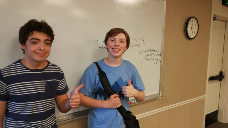 Camas High School (CHS) students Carl Sadewasser (left) and Lucas Farley (right) give the &quot;thumbs up&quot; after taking a free coding class taught by a fellow CHS student, 17-year-old Shile Wen (not pictured).