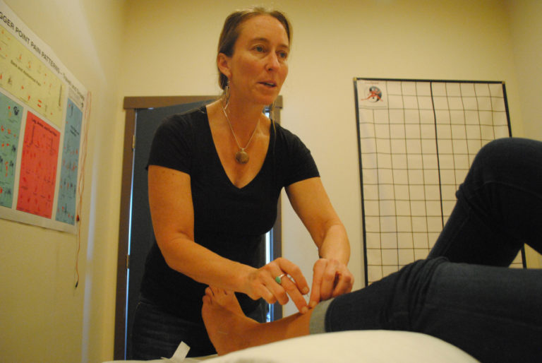 Diane Wintzer, owner of Wintzer Acupuncture, works in her downtown Camas practice on Sept. 25. Wintzer was vocal at the Sept.