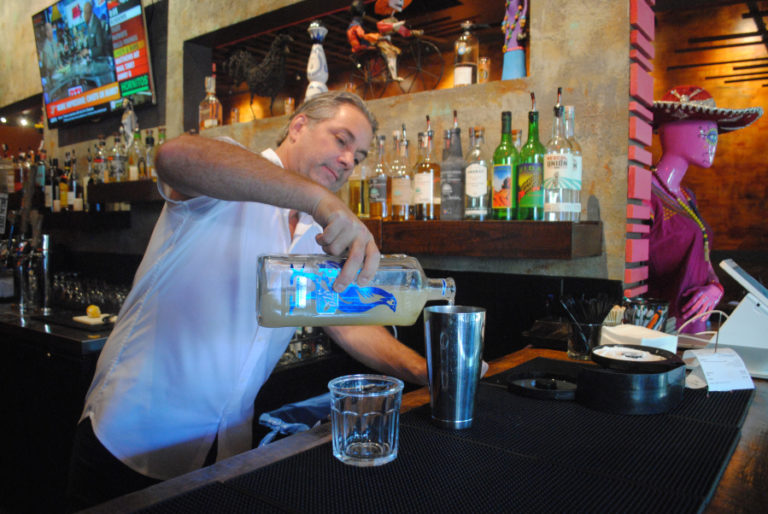 Todd Moravitz, owner of Nuestra Mesa in downtown Camas, pours a drink on Sept. 24. Moravitz and his wife, Tania, spoke in support of downtown events and said festivals help the community.