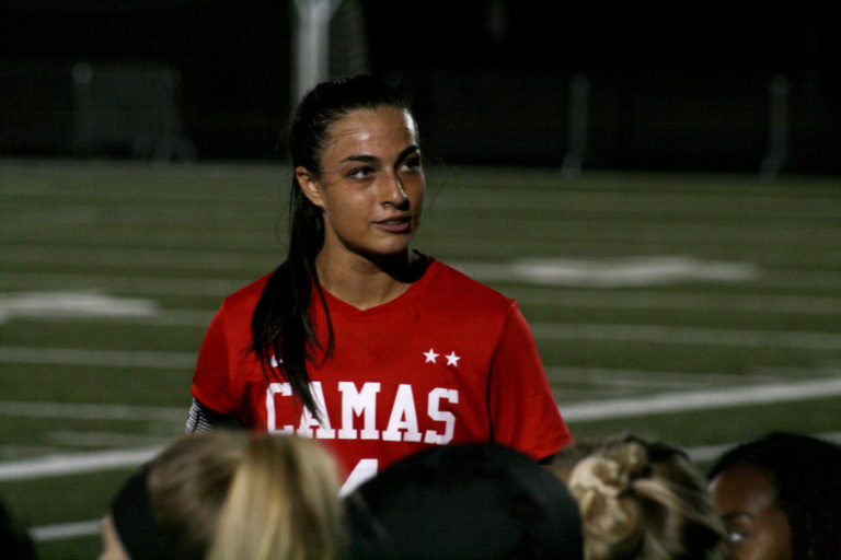 Maddie Kemp thanks her soccer teammates and fans after scoring the 100th goal of her high school career.