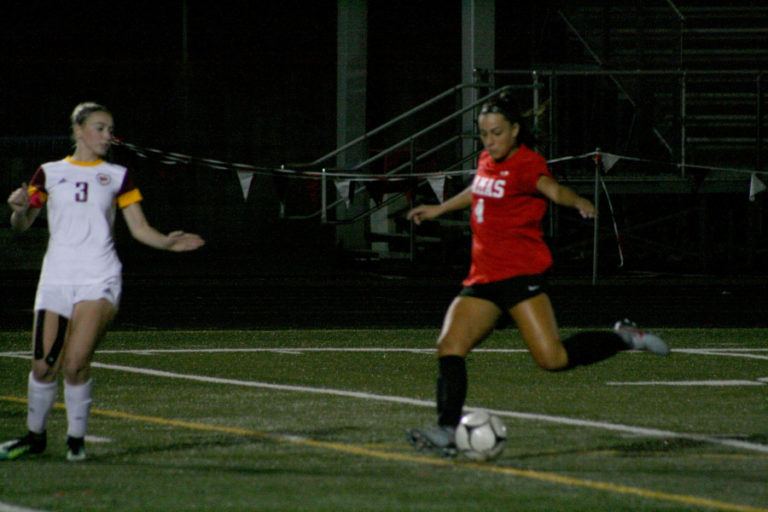 Camas High&#039;s Maddie Kemp fires another rocket kick into the goal at a game against Prairie, Sept.