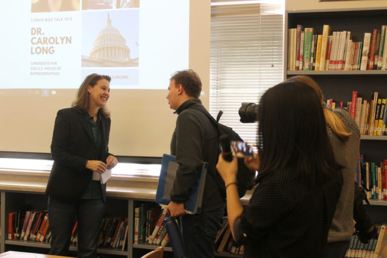 Congressional candidate Dr. Carolyn Long (left), talks to a Camas High student at a &quot;Lunchbox Talk&quot; hosted by DECA Girls Represent on Tuesday, Oct.