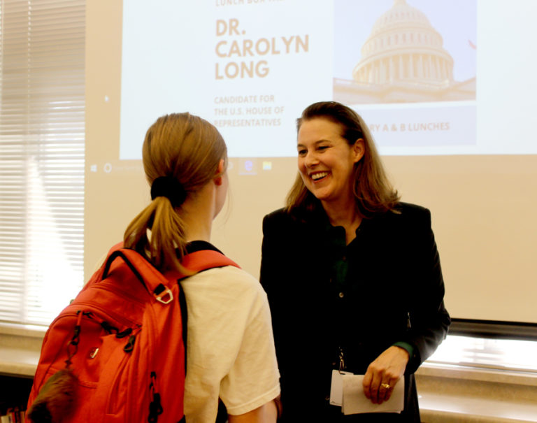 Congressional candidate Dr. Carolyn Long (right), shakes hands with a Camas High student after a &quot;Lunchbox Talk&quot; hosted by DECA Girls Represent inside the Camas High library, on Tuesday, Oct.