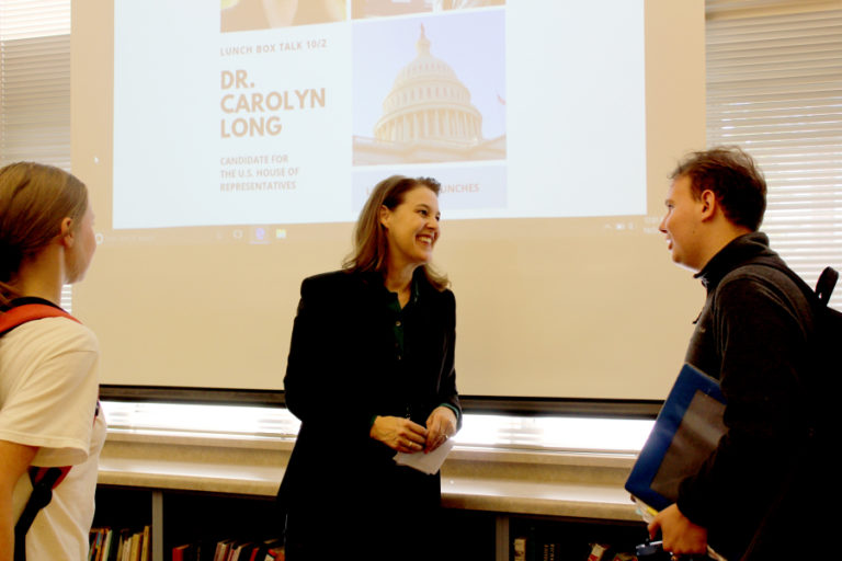 Dr. Carolyn Long (center), a longtime political science professor at Washington State University, Vancouver, who is running for Congress against incumbent 3rd District Rep. Jaime Herrera Beutler, speaks to Camas High students at a &quot;Lunchbox Talk&quot; in the high school library, Tuesday, Oct. 2.