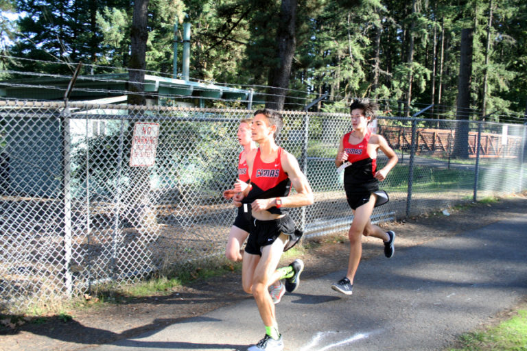 From left to right: Daniel Jackson, Spencer Twyman and Luc Utheza cruise together to victory during a league cross-country meet against Union High Sept.
