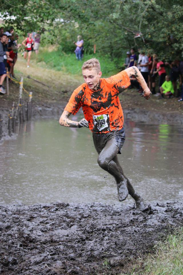 Washougal&#039;s Gabriel Dinnel powers through the mud during a recent meet in Boise, Idaho.  Dinnel finished the Nike Cross Country Invitational in 18th place, in a race that featured hundreds of the top cross-country runners in the western United States.