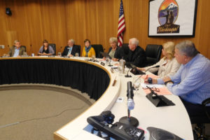 Washougal Mayor Molly Coston (fourth from right) reads a proclamation during a Washougal City Council meeting, Oct. 8. Washougal voters will decide in the Nov. 6 general election whether the form of city government should move away from its "strong mayor" form of government and have a city manager oversee the city's employees and daily business. 