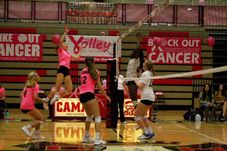 Camas sophomore Grace Varsek rises up for a spike against Skyview. The Camas gym was decorated in pink to raise breast cancer awareness.