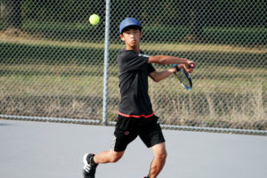 Sunny Wang dominates his match 6-0 6-0, a score known as a "double bagel."