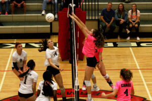 Camas High's Mackenzie Hancock (second from right) wins a point against Skyview, Oct. 2.