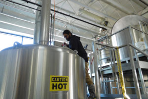 Head brewer Shilpi Halemane stirs oatmeal stout in the Logsdon Farmhouse Ales brewery in downtown Washougal.