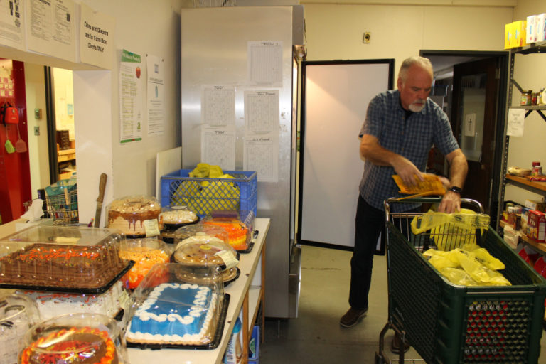 John McHugh, of Camas, loads frozen meats and donated baked goods from local grocery stores into food bags for families in need at the Inter-Faith Treasure House in November 2017. McHugh is one of 150 volunteers who keep Treasure House running. The local nonprofit, which helps thousands of low-income Camas-Washougal families, is partially funded by an annual Camas-Washougal Community Chest grant.