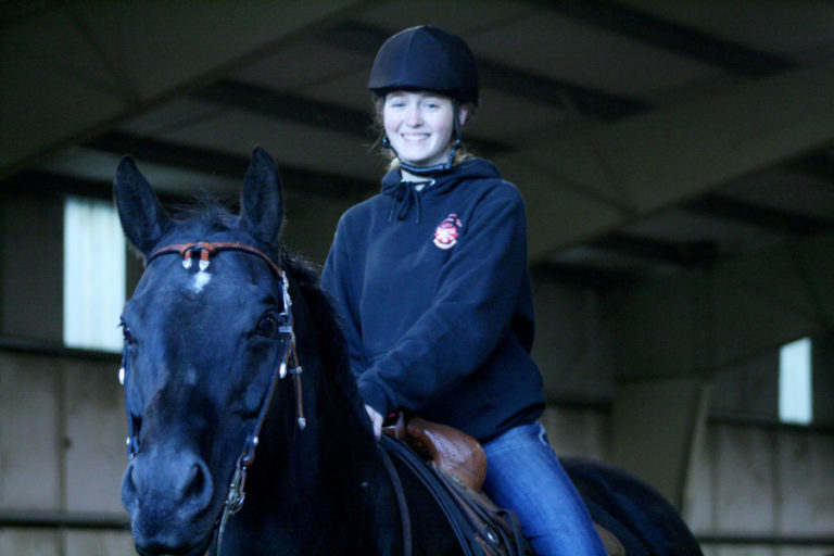 Camas High junior Hailey Whidden, pictured here at Green Mountain Stables in Camas, says she is thrilled to start a new season of equestrian riding and competition.
