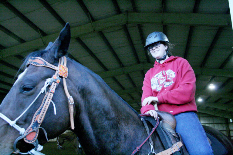 Camas High junior Natalie Cole shows off her horse, Maverick, during the first equestrian team practice of the season.