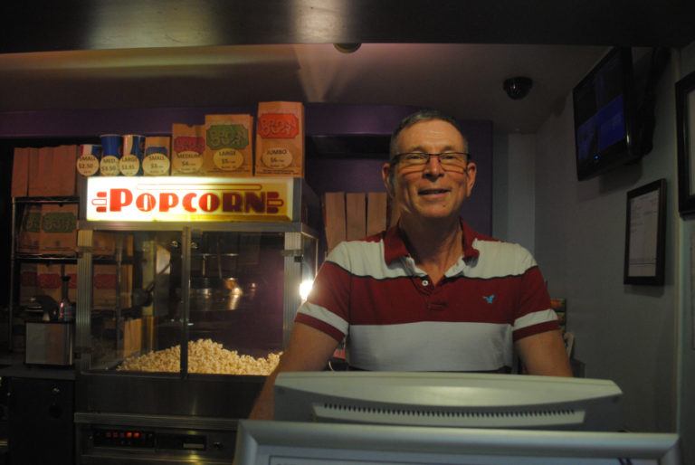 Rand Thornsley, operator of the Liberty Theatre since 2011, stands at the front counter.
