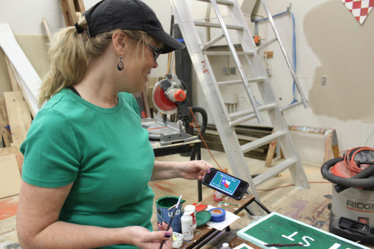 Faun Corkum, mother of Washougal High School senior Tori Corkum (not pictured) shows the template she is painting Oct. 20, for the &quot;Texas Chainsaw Massacre&quot; prop to be used in the high school&#039;s upcoming &quot;Screen Screams&quot; haunted house, which opens Friday, Oct.