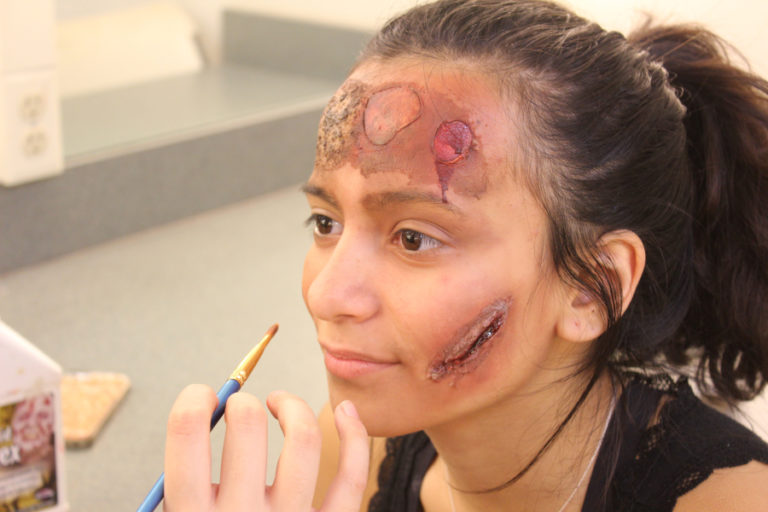 Alexis Brock, 16, a junior at Washougal High School, models various makeup effects Oct.