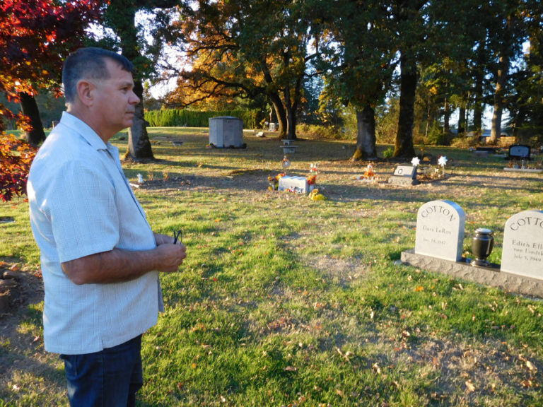 William Zalpys looks out over several natural burial and traditional grave sites in the Fern Prairie Cemetery. Zalpys, a Clark County Cemetery District No. 1 commissioner, said there have been 89 natural burials since 2008 at the cemetery, located north of Camas.