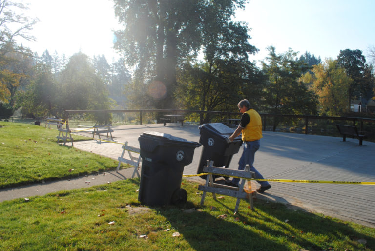 Garry Reed, Camas sanitation lead, wheels bins over to his truck at the Sandy Swimming Hole on Oct. 22.