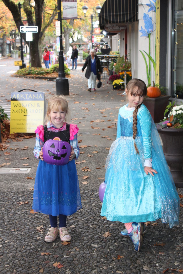 It wouldn't be Halloween without an Anna and Elsa sighting. Here, Kaia Lana, 7 (right), and her neighbor, Adriana, 5, pose near Arktana boutique in downtown Camas during the 2018 Boo Bash on Wednesday, Oct. 24. 