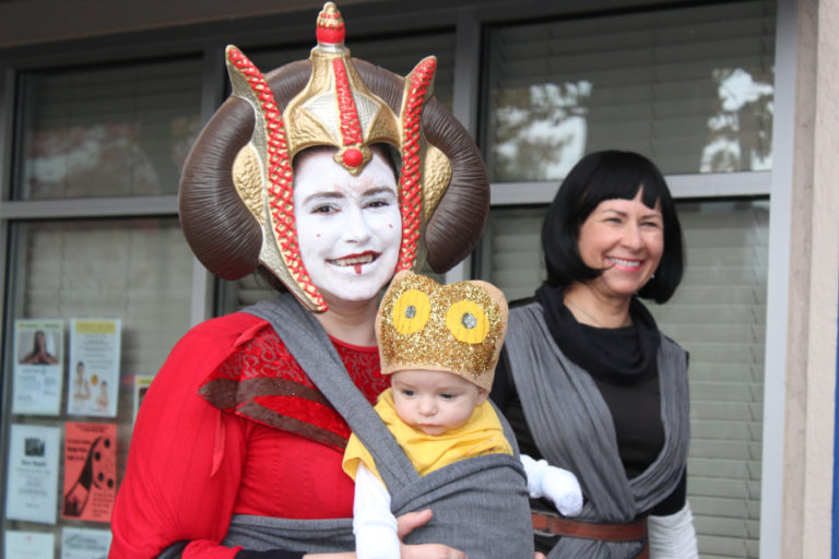 Kimberlee Wildman, dressed as Star Wars Queen Padme Amidala, wears her 2-month-old son, Jeremiah Wildman.