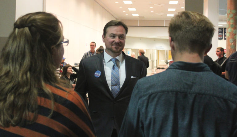 Clark County Council Chair Democrat candidate Eric Holt talks to community members at an Oct. 22 candidate forum at Camas High School. Holt held a slight lead over Republican Clark County Councilwoman Eileen Quiring, as of this paper&#039;s print deadline.