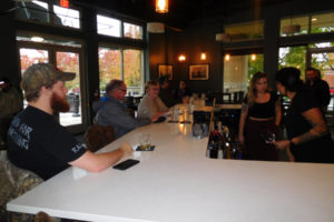 The 2 Rivers Bar & Grill staff go through the new restaurants "soft opening" on Oct. 25, four days before the grand opening in Washougal Town Square, in downtown Washougal. Derik Ford (right) and Michelle Ford (not pictured) own the eatery, which serves steak, salmon, salads, sandwiches and small plates. 