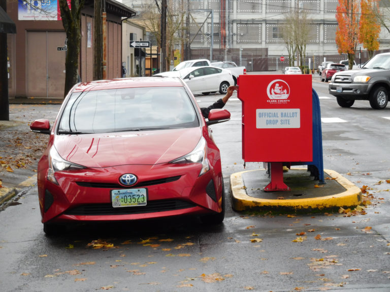 (Dawn Feldhaus/Post-Record)
A voter drops off a ballot in the 24-hour ballot drop box, next to the Camas Post Office, 440 N.E. Fifth Ave., Camas. The Nov. 6 general election ballots, with pre-paid postage envelopes, can be mailed at no cost to voters. Ballots must be postmarked by Tuesday, Nov. 6, or taken to a drop box or deposit location by 8 p.m., election day.