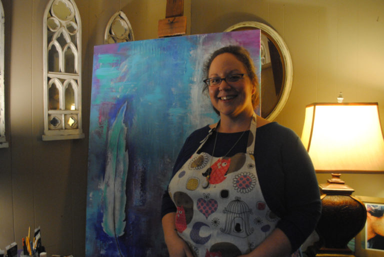 Anni Furniss poses with one of her pieces in her home on Nov. 3.